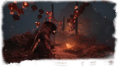 A hooded warrior crouches beside a cracked stone path under hanging red lanterns, with a small fire burning ahead in the dark.