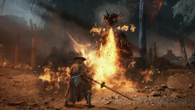 A figure in a broad hat faces a towering black-and-gold boss wreathed in fire.